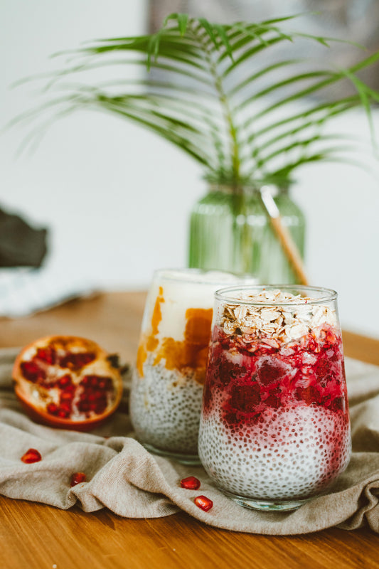 Two types of yogurt topped with oats and chia seeds, illustrating healthy digestion and gut-friendly foods.